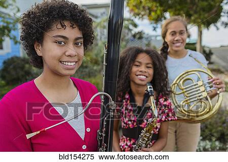 Stock Photography - Pacific Islander girls holding musical instruments. Fotosearch