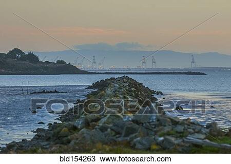 Rocky jetty in ocean bay View Large Photo Image Stock Image - Rocky jetty in ocean bay. Fotosearch