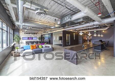 Stock Photo - Sofas in open office seating area. Fotosearch