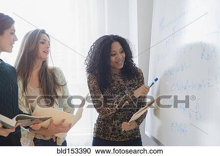 Students using whiteboard in classroom View Large Photo Image Stock Image - Students using whiteboard in classroom. Fotosearch