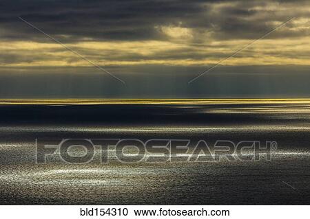 Sunbeams shining over ocean seascape View Large Photo Image Stock Image - Sunbeams shining over ocean seascape. Fotosearch