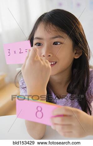 Vietnamese girl studying math with flash cards View Large Photo Image Stock Photo - Vietnamese girl studying math with flash cards. Fotosearch