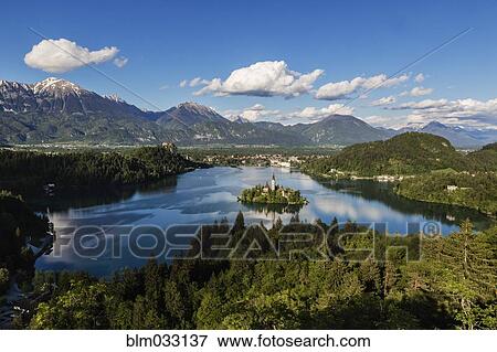Stock Photo - Aerial view of castle on island in still remote lake. Fotosearch