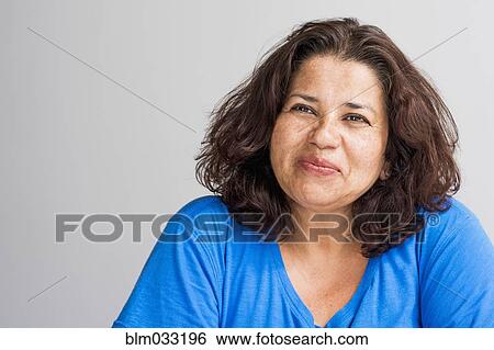 Stock Photograph - Close up of Hispanic woman smiling. Fotosearch