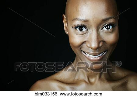 Stock Photograph - Close up of smiling face of African American woman. Fotosearch
