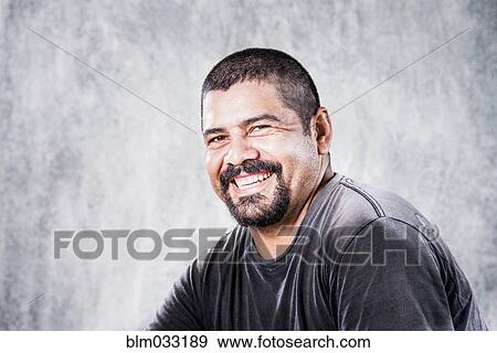 Close up of smiling Hispanic man View Large Photo Image Stock Photo - Close up of smiling Hispanic man. Fotosearch