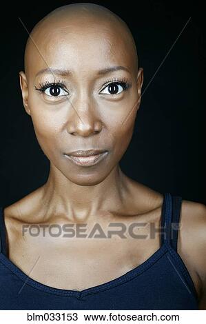 Stock Image - Close up of surprised face of African American woman. Fotosearch