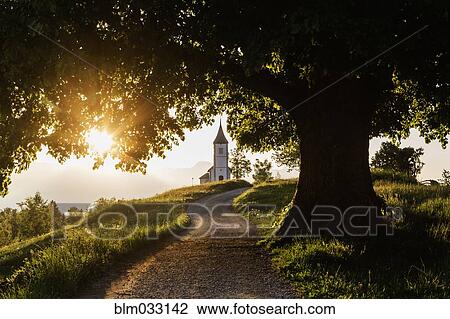 Dirt road leading to remote hilltop church View Large Photo Image Stock Image - Dirt road leading to remote hilltop church . Fotosearch
