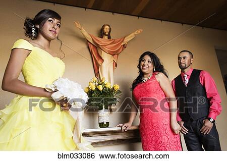Hispanic family celebrating quinceanera in church View Large Photo Image Stock Photograph - Hispanic family celebrating quinceanera in church. Fotosearch
