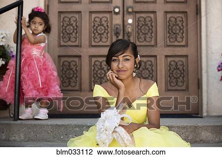 Hispanic girl celebrating quinceanera outside Catholic church View Large Photo Image Stock Image - Hispanic girl celebrating quinceanera outside Catholic church. Fotosearch