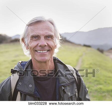 Older Caucasian man walking on dirt trail View Large Photo Image Stock Photo - Older Caucasian man walking on dirt trail. Fotosearch