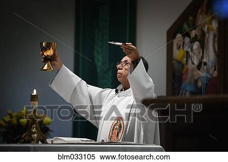 Priest giving sermon in Catholic church View Large Photo Image Stock Photography - Priest giving sermon in Catholic church. Fotosearch