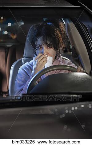 Sick woman driving car at night View Large Photo Image Stock Photograph - Sick woman driving car at night. Fotosearch