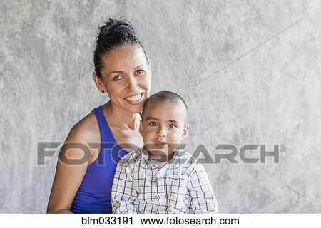 Stock Image - Smiling Hispanic mother and son. Fotosearch