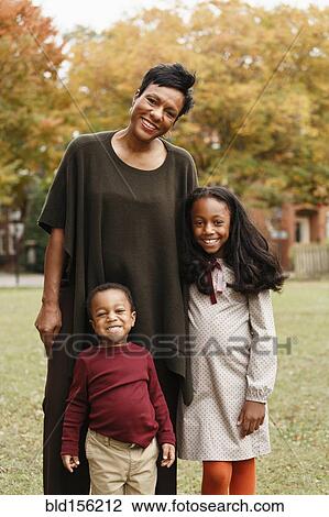 African American mother and children smiling in park View Large Photo Image Stock Image - African American mother and children smiling in park. Fotosearch