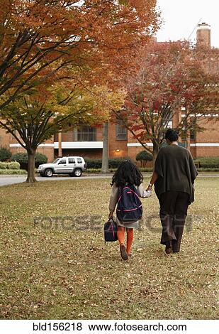 African American mother walking daughter to school View Large Photo Image Stock Photo - African American mother walking daughter to school. Fotosearch