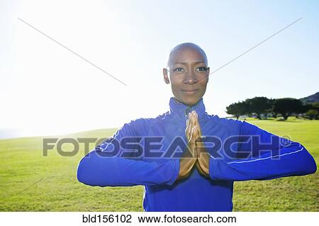 African American woman meditating in park View Large Photo Image Stock Image - African American woman meditating in park. Fotosearch