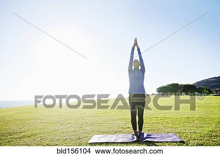 African American woman practicing yoga in park View Large Photo Image Picture - African American woman practicing yoga in park. Fotosearch