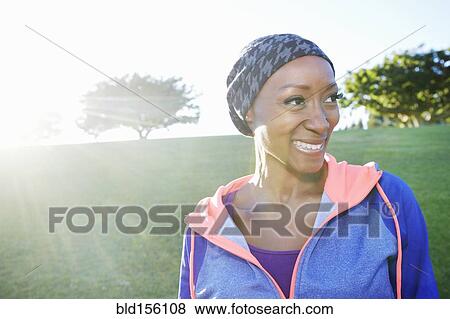 African American woman smiling in park View Large Photo Image Stock Photo - African American woman smiling in park. Fotosearch