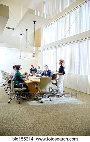 Picture - Business people talking in office meeting. Fotosearch