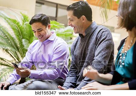 Business people talking in office courtyard View Large Photo Image Stock Photo - Business people talking in office courtyard. Fotosearch