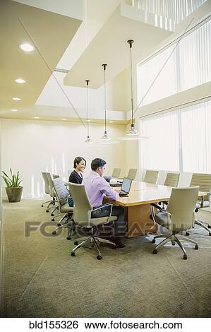 Stock Photograph - Business people talking in office meeting. Fotosearch