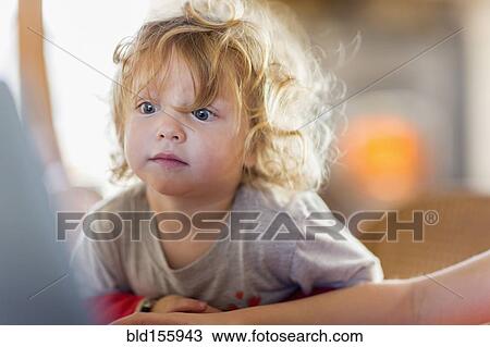 Caucasian baby boy peering at computer screen View Large Photo Image Stock Image - Caucasian baby boy peering at computer screen. Fotosearch