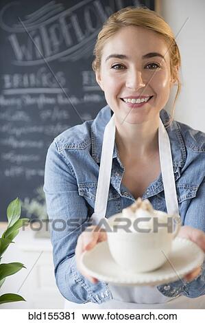 Caucasian barista serving coffee drink in cafe View Large Photo Image Stock Image - Caucasian barista serving coffee drink in cafe. Fotosearch