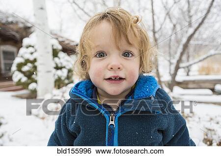 Caucasian boy standing in snow View Large Photo Image Stock Photograph - Caucasian boy standing in snow. Fotosearch