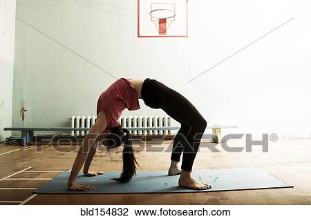Caucasian dancer stretching and balancing in gym View Large Photo Image Stock Image - Caucasian dancer stretching and balancing in gym. Fotosearch