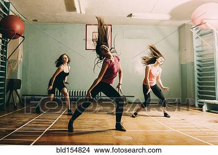 Picture - Caucasian dancers rehearsing in gym. Fotosearch