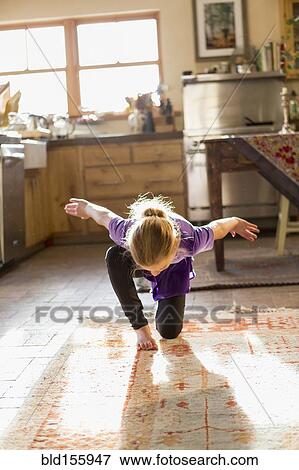 Caucasian girl dancing in kitchen View Large Photo Image Stock Photo - Caucasian girl dancing in kitchen. Fotosearch