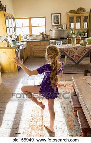 Caucasian girl dancing in kitchen View Large Photo Image Stock Photo - Caucasian girl dancing in kitchen. Fotosearch