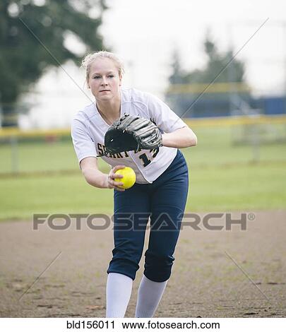 Caucasian softball player pitching ball in field View Large Photo Image Stock Image - Caucasian softball player pitching ball in field. Fotosearch