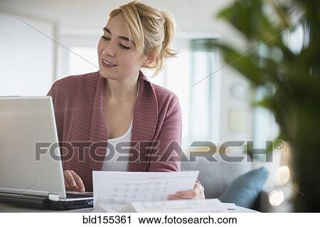 Caucasian woman paying bills online View Large Photo Image Stock Image - Caucasian woman paying bills online. Fotosearch