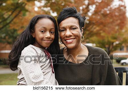 Close up of African American mother and daughter smiling View Large Photo Image Stock Photography - Close up of African American mother and daughter smiling. Fotosearch