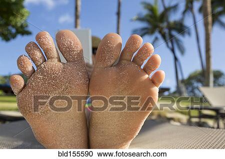 Close up of bottom of sandy feet of Caucasian woman View Large Photo Image Stock Image - Close up of bottom of sandy feet of Caucasian woman. Fotosearch
