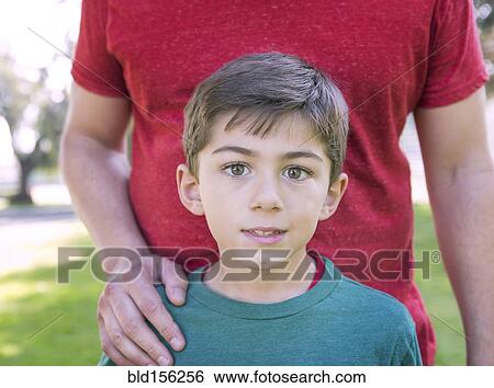 Close up of Caucasian father and son in park View Large Photo Image Stock Photograph - Close up of Caucasian father and son in park. Fotosearch