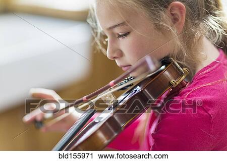 Close up of Caucasian girl practicing violin View Large Photo Image Stock Image - Close up of Caucasian girl practicing violin. Fotosearch