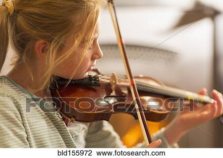 Close up of Caucasian girl practicing violin View Large Photo Image Stock Image - Close up of Caucasian girl practicing violin. Fotosearch