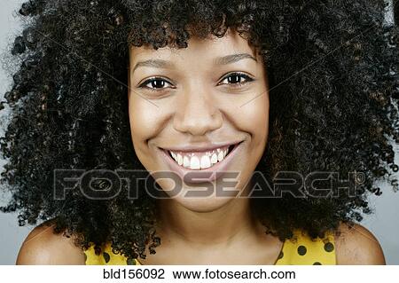 Stock Image - Close up of face of mixed race woman. Fotosearch