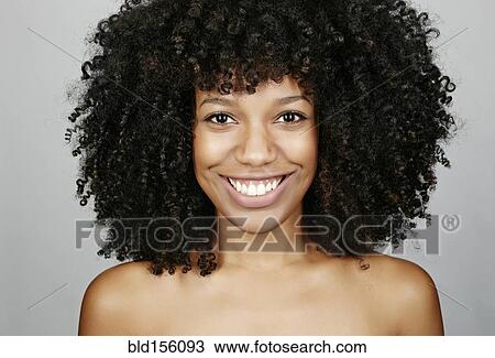 Stock Image - Close up of face of mixed race woman. Fotosearch