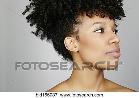 Stock Photo - Close up of face of mixed race woman. Fotosearch