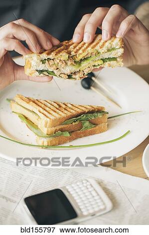 Close up of man eating sandwich View Large Photo Image Stock Photo - Close up of man eating sandwich. Fotosearch