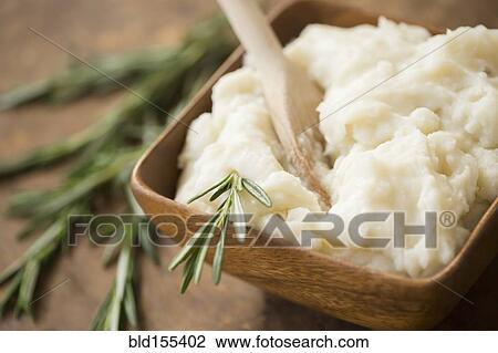 Close up of mashed potatoes and rosemary View Large Photo Image Stock Image - Close up of mashed potatoes and rosemary. Fotosearch
