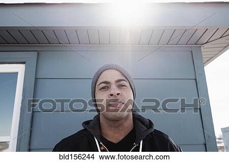 Close up of mixed race man frowning outdoors View Large Photo Image Picture - Close up of mixed race man frowning outdoors. Fotosearch
