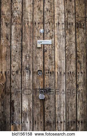 Close up of padlocks on secure door View Large Photo Image Stock Photo - Close up of padlocks on secure door. Fotosearch