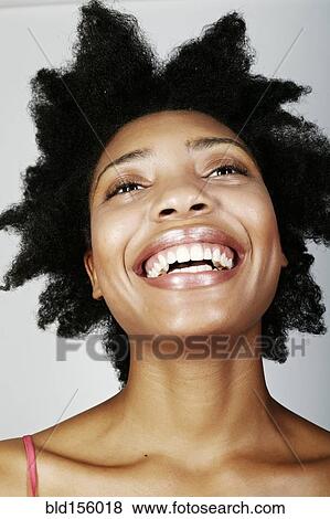 Close up of smiling black woman View Large Photo Image Stock Photo - Close up of smiling black woman. Fotosearch