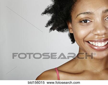 Stock Photography - Close up of smiling black woman. Fotosearch