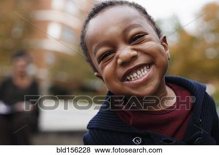 Close up of smiling face of African American boy View Large Photo Image Stock Photo - Close up of smiling face of African American boy. Fotosearch